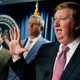 House Speaker Philip Gunn, R-Clinton, center, listens as Republican Gov. Tate Reeves, speaks about signing a bill that will reduce the state income tax over four years, beginning in 2023, at his office in Jackson, Miss., Tuesday, April 5, 2022.